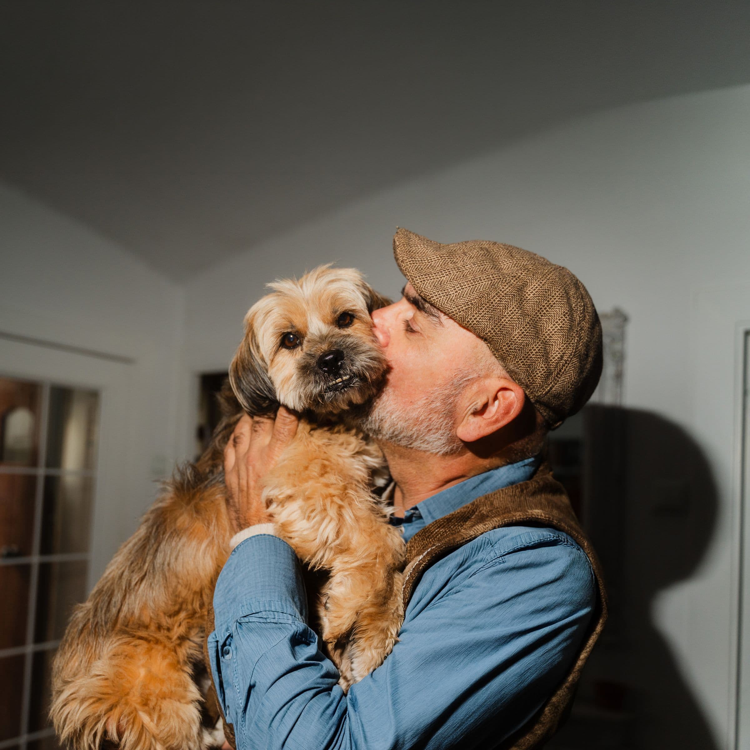 Man kissing his dog